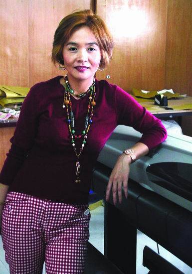 蔡美月（服饰有限公司创办者兼总设计师）